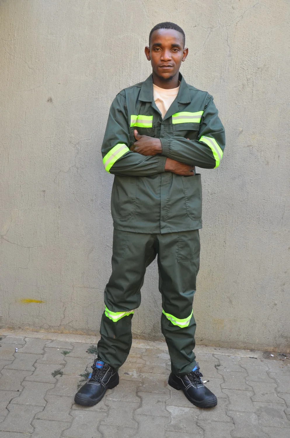 Olive green overalls with lime reflective bands