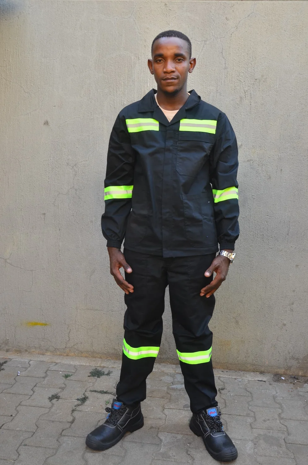 Black overalls with lime reflective bands